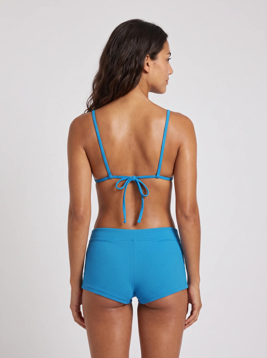 Shorty Cabine 9, porté vue dos en studio, maillot de bain Palm Club